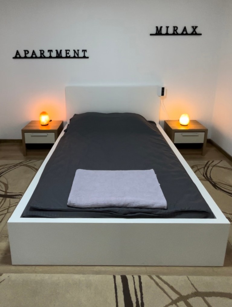 Freshly made double bed with towels