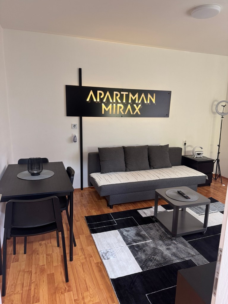 Sofa, coffee table and dining table in the MIRAX living room