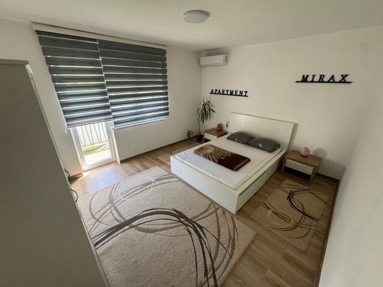 MIRAX bedroom with a double bed, air conditioning and access to the terrace